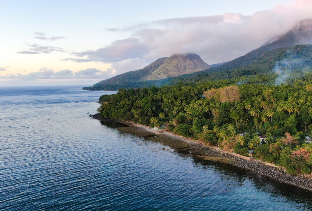 Aerial view of coastline and volcano in Camiguin Island, Philippines