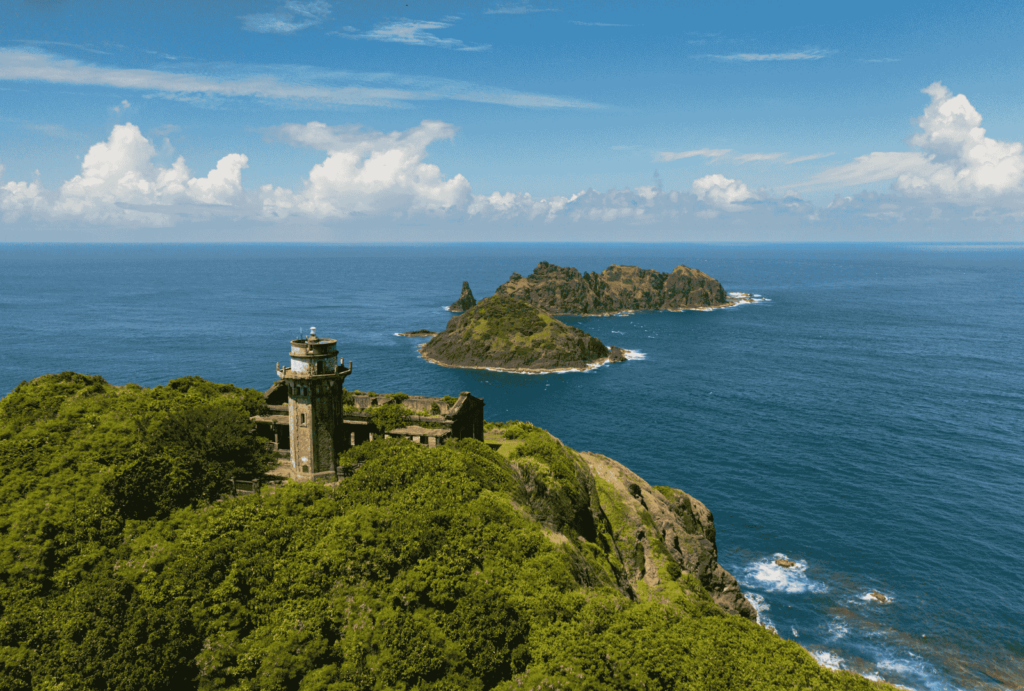 Aerial view of lighthouse on tropical islands with background of blue ocean.