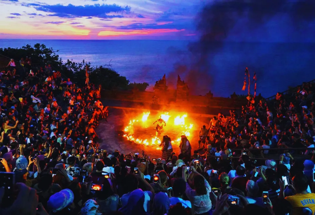 The dramatic Kecak Fire Dance performance at Uluwatu Temple, Bali, at sunset. A key cultural highlight for premium Indonesia holidays and curated Indonesia travel experiences.