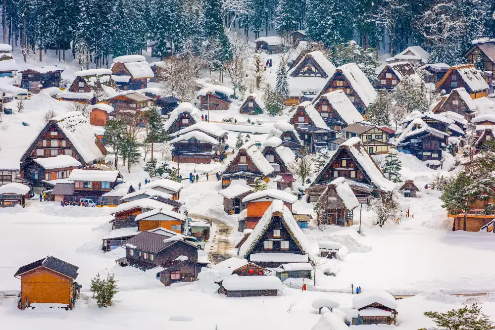 Snow-covered traditional gassho-zukuri farmhouses in Shirakawa-go, a UNESCO World Heritage site featured in private Japan travel packages.