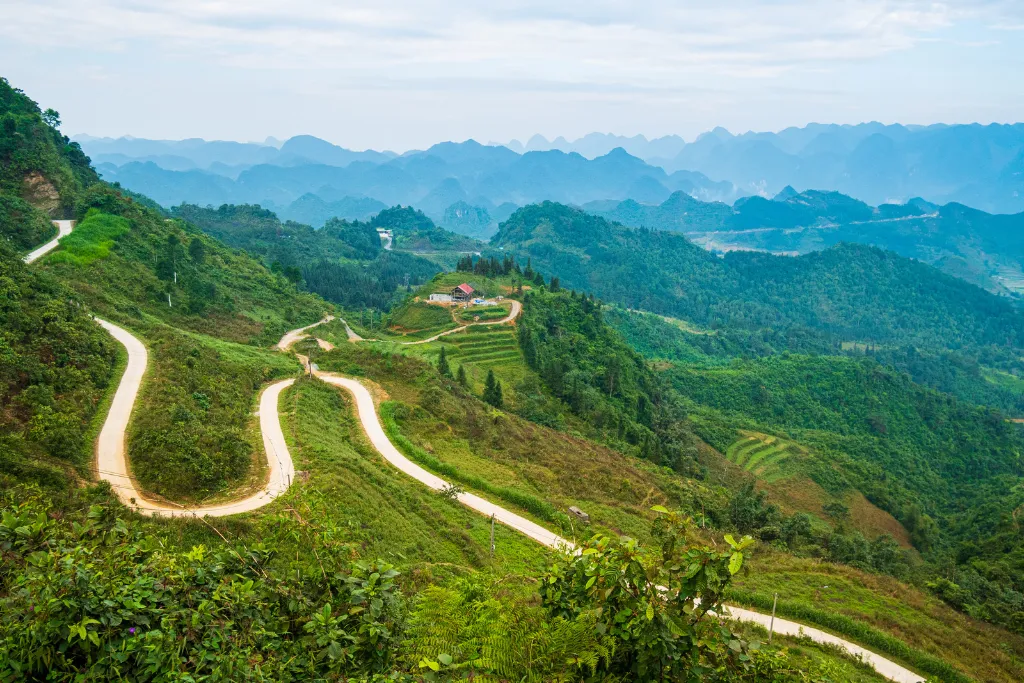 Switchback road through limestone mountains in Ha Giang, northern Vietnam