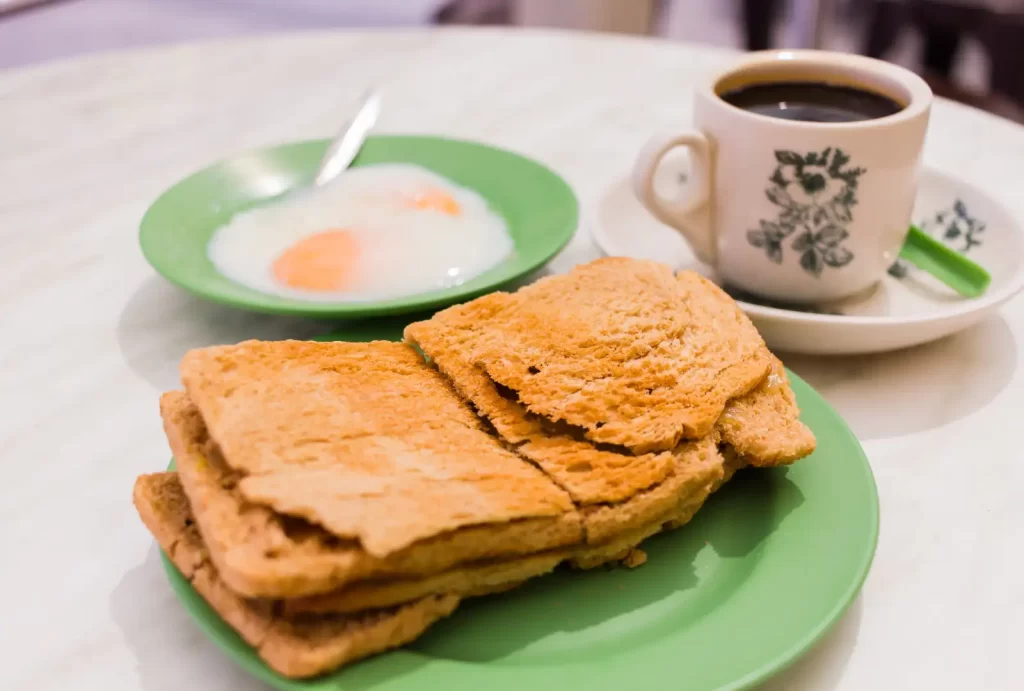 Singapore Breakfast called Kaya Toast, Crispy Bread and poached eggs