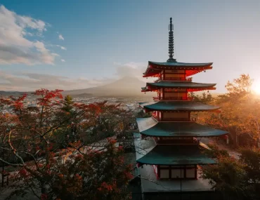 A breathtaking sunset view of Chureito Pagoda and Mount Fuji in autumn, showcasing exclusive experiences curated by a premier Japan DMC for luxury travelers.