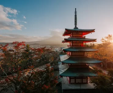 A breathtaking sunset view of Chureito Pagoda and Mount Fuji in autumn, showcasing exclusive experiences curated by a premier Japan DMC for luxury travelers.