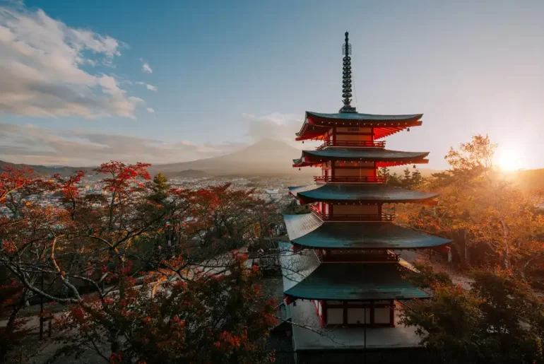 A breathtaking sunset view of Chureito Pagoda and Mount Fuji in autumn, showcasing exclusive experiences curated by a premier Japan DMC for luxury travelers.