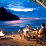 Romantic luxury beach holiday dinner in Malaysia for couples, ideal for a romantic travel getaway planned by a Malaysia DMC.