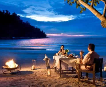 Romantic luxury beach holiday dinner in Malaysia for couples, ideal for a romantic travel getaway planned by a Malaysia DMC.