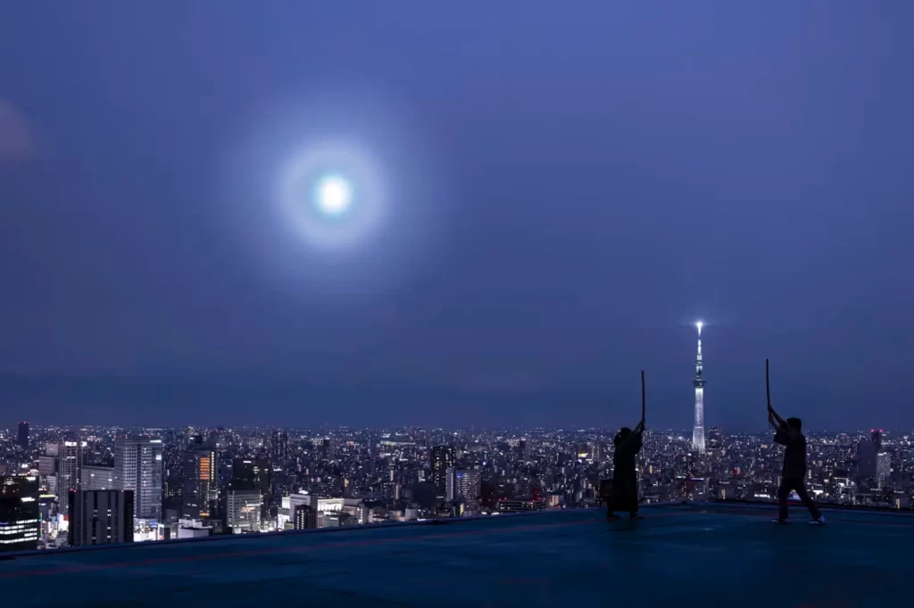 Private rooftop kenjutsu sword session at night overlooking the Tokyo skyline and Skytree – exclusive cultural experience in Japan