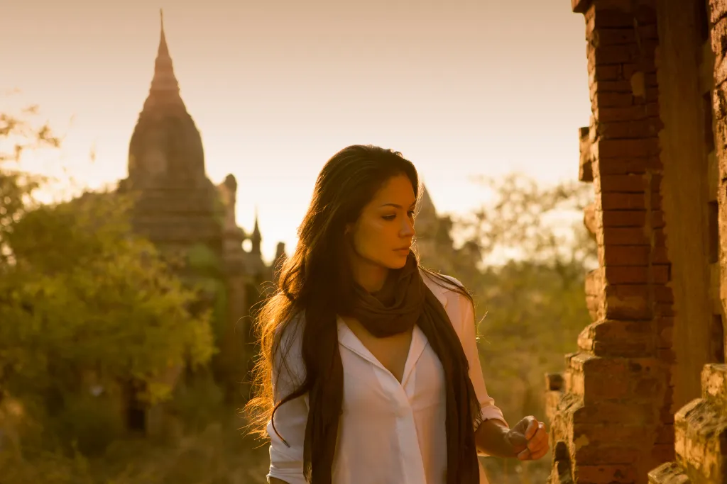Traveller exploring ancient Bagan temples at sunrise, away from the crowds, Myanmar