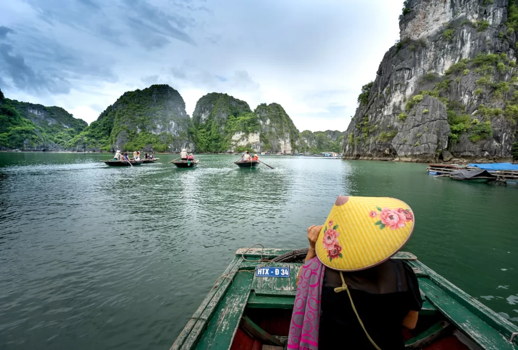 Discover the majestic beauty of Halong Bay's iconic limestone formations from the comfort of a private boat.