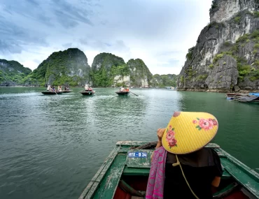 Discover the majestic beauty of Halong Bay's iconic limestone formations from the comfort of a private boat.