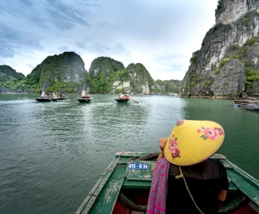 Discover the majestic beauty of Halong Bay's iconic limestone formations from the comfort of a private boat.