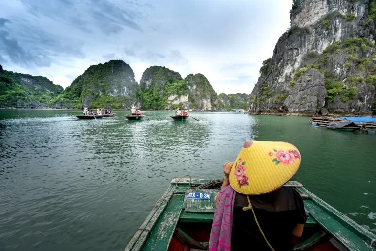 Discover the majestic beauty of Halong Bay's iconic limestone formations from the comfort of a private boat.