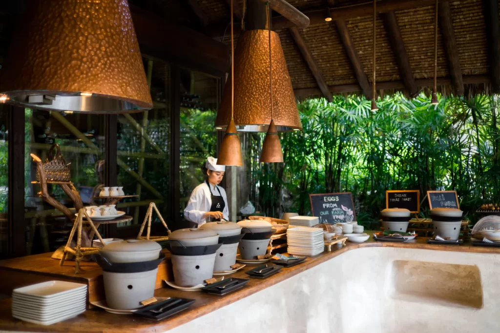 Chef preparing farm-to-table breakfast buffet at open-air jungle resort, Thailand — Discovery DMC luxury Thailand travel for travellers