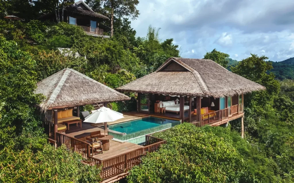 Overwater teak pool villa set in tropical jungle canopy, Thailand — Discovery DMC luxury Thailand tours for travel advisors