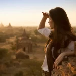 Traveller watching sunrise over the temples of Bagan, Myanmar