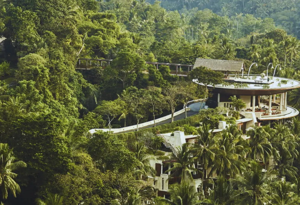 Exclusive luxury jungle resort in Ubud, Bali, showcasing private villa accommodations nestled in the rainforest.