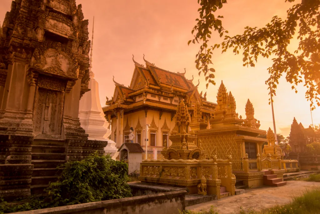 Witness a breathtaking sunset over the golden pagodas of Phnom Sampov in Battambang, offering an exquisite backdrop for luxury travel and incentive groups.