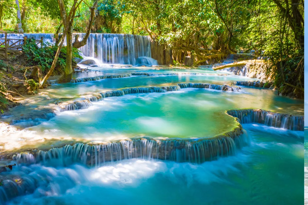 Stunning turquoise multi-tiered pools of Kuang Si Falls in Luang Prabang, an iconic natural wonder for luxury adventure travelers and incentive groups in Laos.
