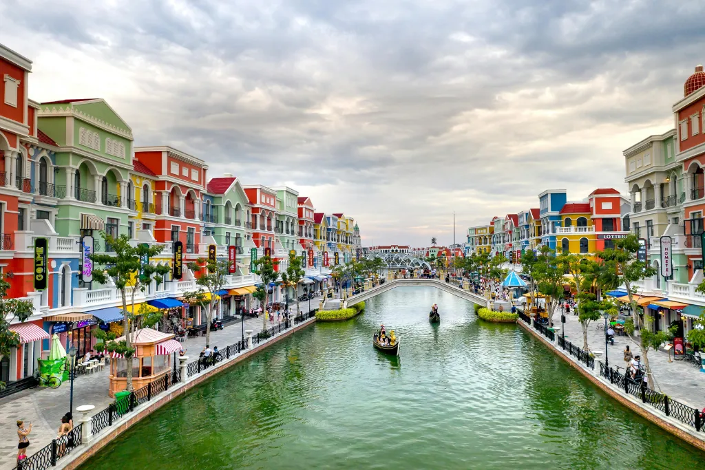 Captivating Grand World Phu Quoc with its vibrant, European-inspired architecture along a serene canal, offering unique cultural experiences for luxury travelers and MICE groups.