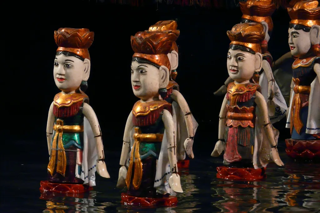 Vibrant traditional Vietnamese water puppets performing, a unique cultural experience offered by our luxury travel and MICE services in Hanoi.