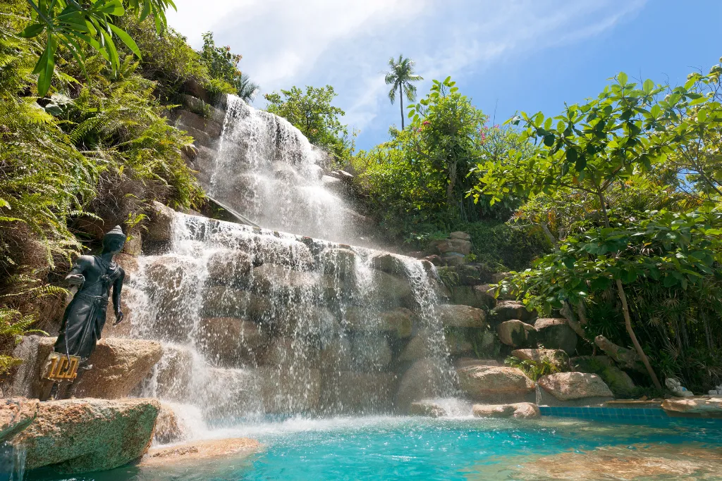 A beautiful waterfall and pool area at a high-end resort in Ko Pha-ngan, Thailand. This offers an ideal, unique setting for MICE travel, including corporate retreats and high-end incentive trips in a peaceful, natural-like environment.