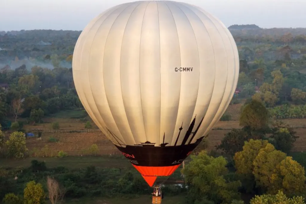 A hot air balloon ascent over the lush landscape, offering an exclusive view for luxury Cambodia tours. Elevate your Cambodia travel experience with premium sightseeing arranged by our Cambodia DMC.