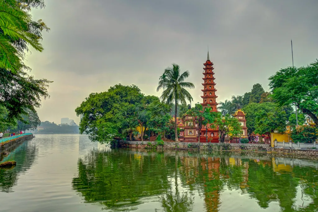 Scenic view of the iconic Tien Sai Pagoda on Hoan Kiem Lake in Hanoi, Vietnam. This historic landmark is a must-see stop on all premium Hanoi tours and Vietnam sightseeing itineraries, curated by our Vietnam DMC experts.
